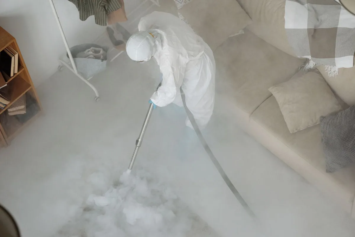 Biohazard cleanup technician in protective equipment, Gautier, MS